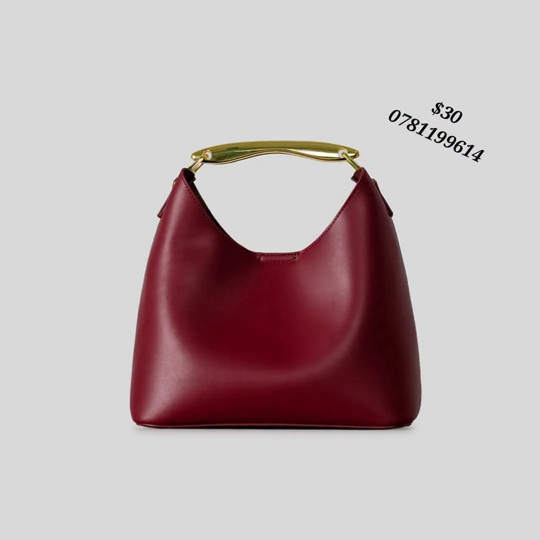 Elegant Burgundy Handbag with Gold Handle