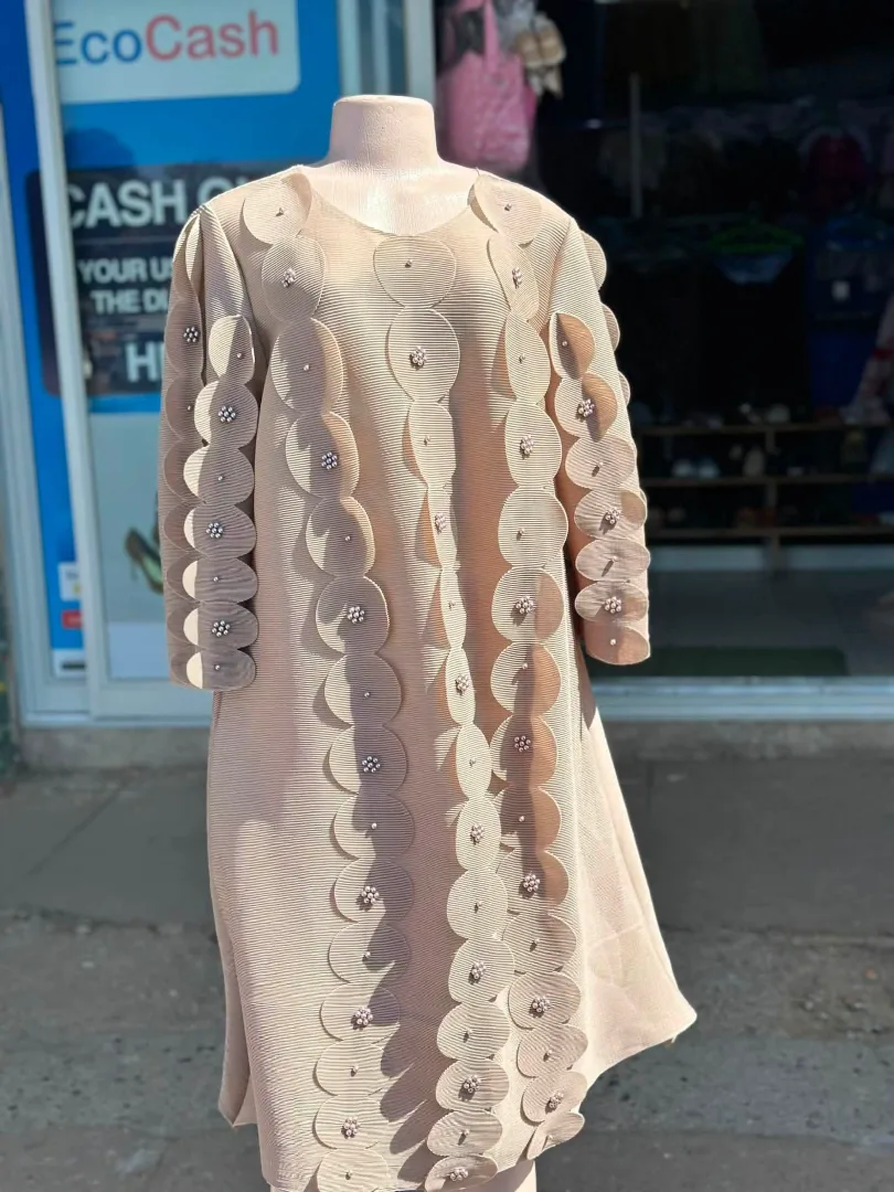 Elegant Beige Dress with Decorative Accents